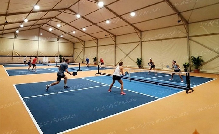 Pickleball court tent with transparent side walls for natural daylight and open views