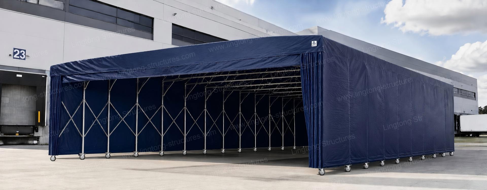 8611787817438543.jpg Retractable mobile storage tent expanded on factory floor providing covered storage space for materials
