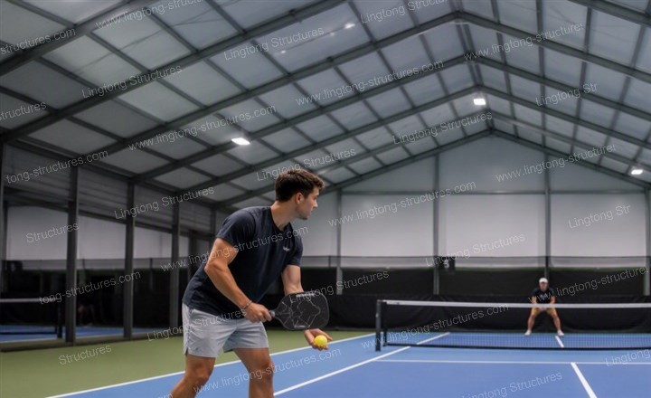 911787559009215.jpg Spacious interior of prefabricated pickleball hall with multiple courts and overhead lighting