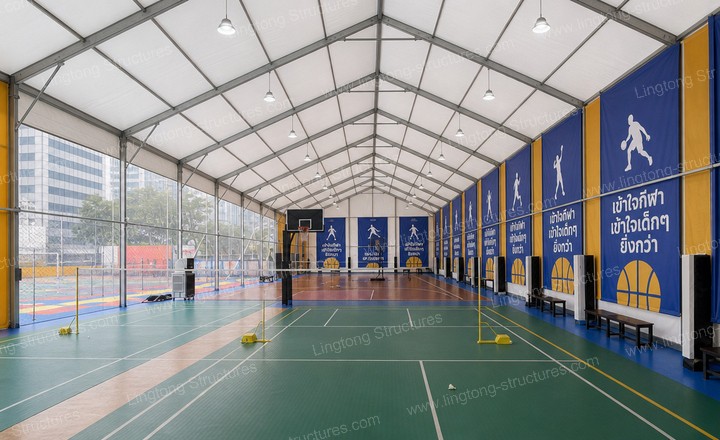 1341789458450775.jpg Aerial view of two outdoor basketball court tents on both sides of existing court