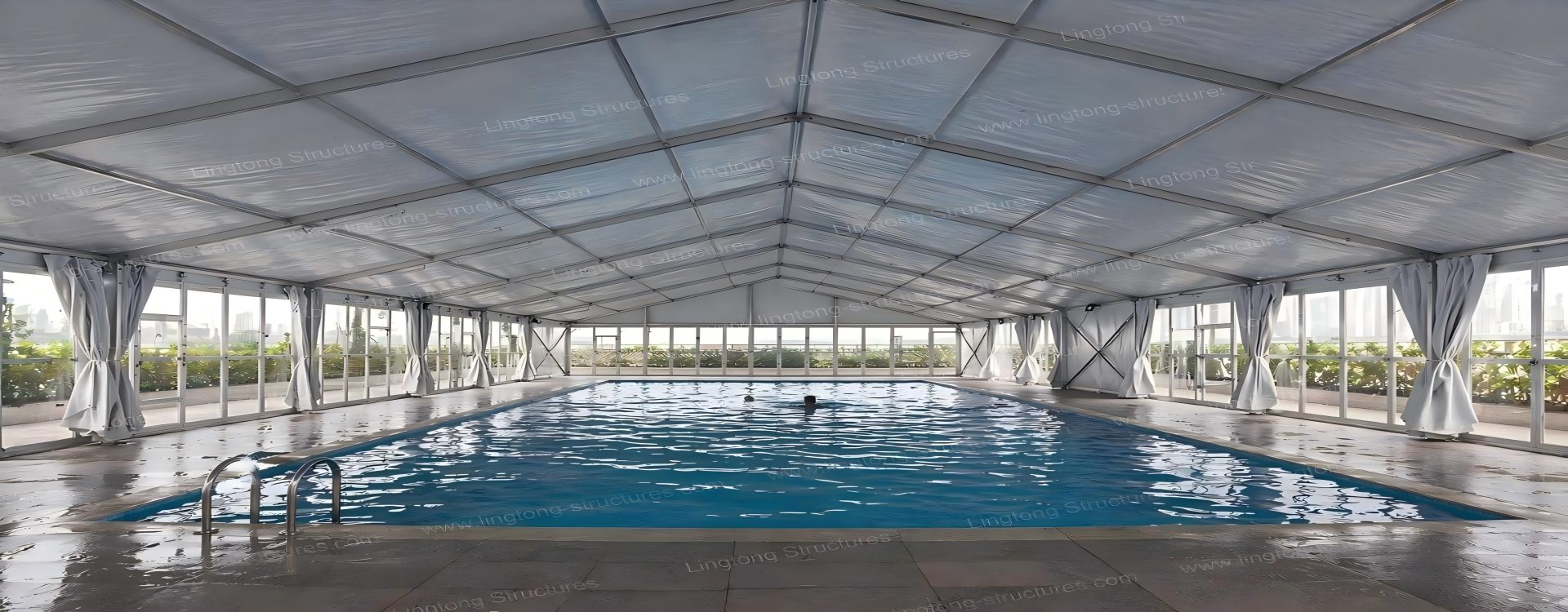 Large aluminum swimming pool tent covering an outdoor school pool Large aluminum swimming pool tent covering an outdoor school pool for year-round swimming classes