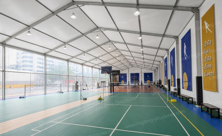 6181789458460788.jpg Interior of outdoor basketball court tent with LED lighting and sports flooring